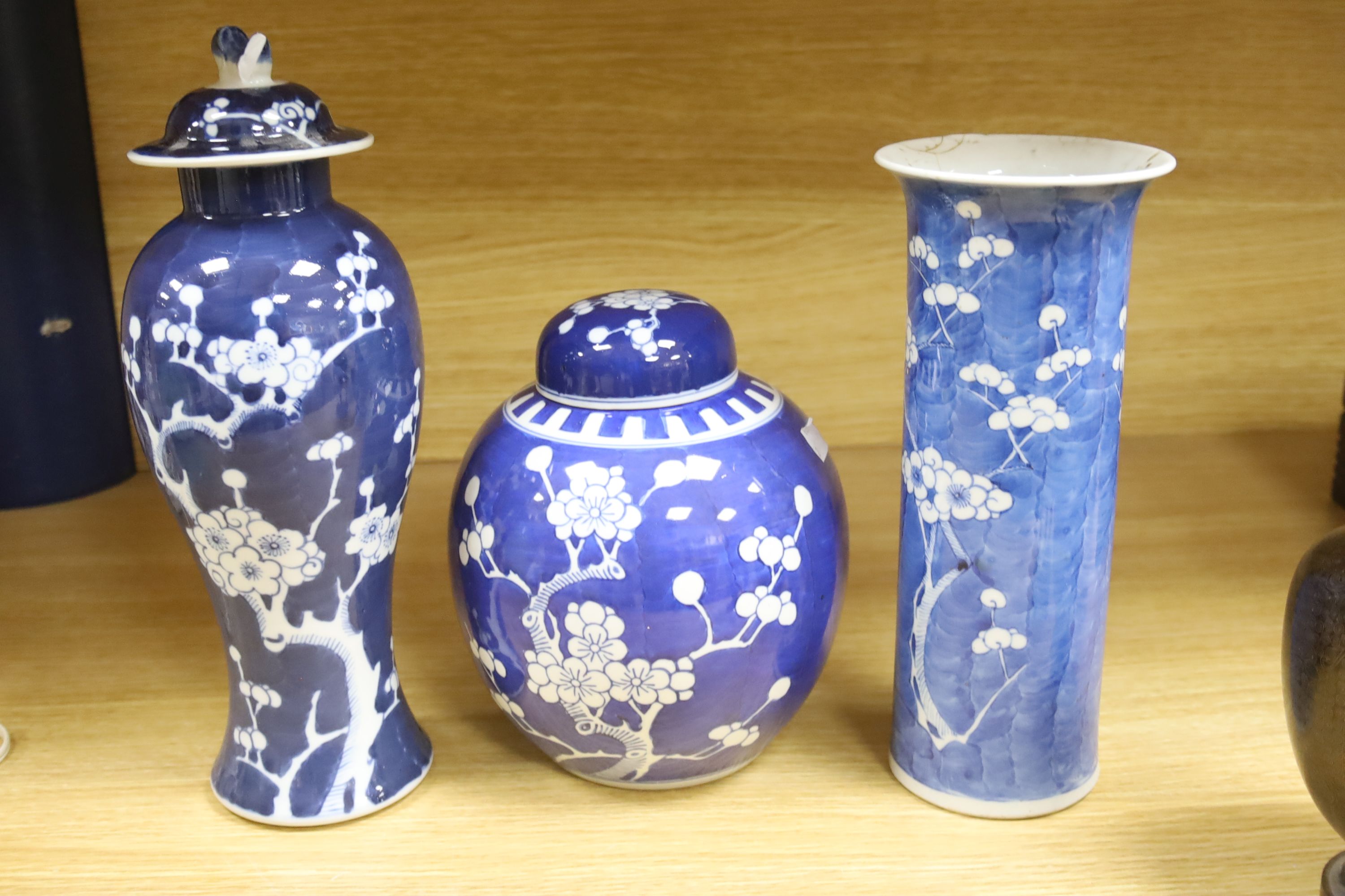 A Chinese blue and white cylindrical vase, another vase and cover and a blue and white jar and cover, together with a cloisonne vase and a bronze censer, tallest 32cm